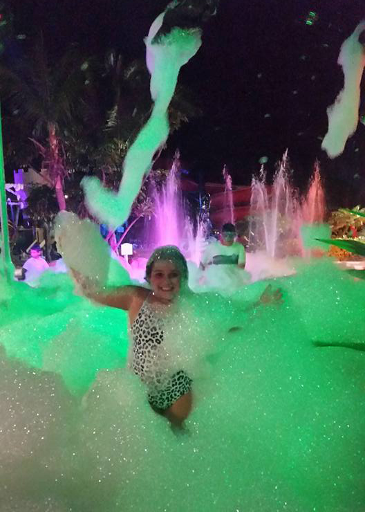 Laura's daughter has a blast at the foam party.
